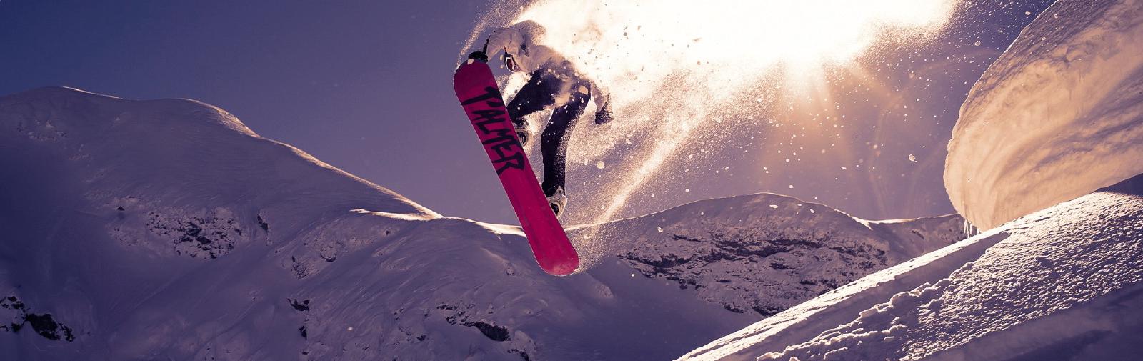 Snowboarding trick jump snow.